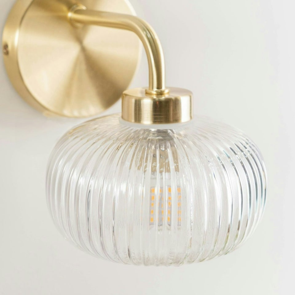 image 1 of ValueLights Amaia Pair of Brushed Gold IP44 Clear Ribbed Glass Wall Lights with LED Bulbs
