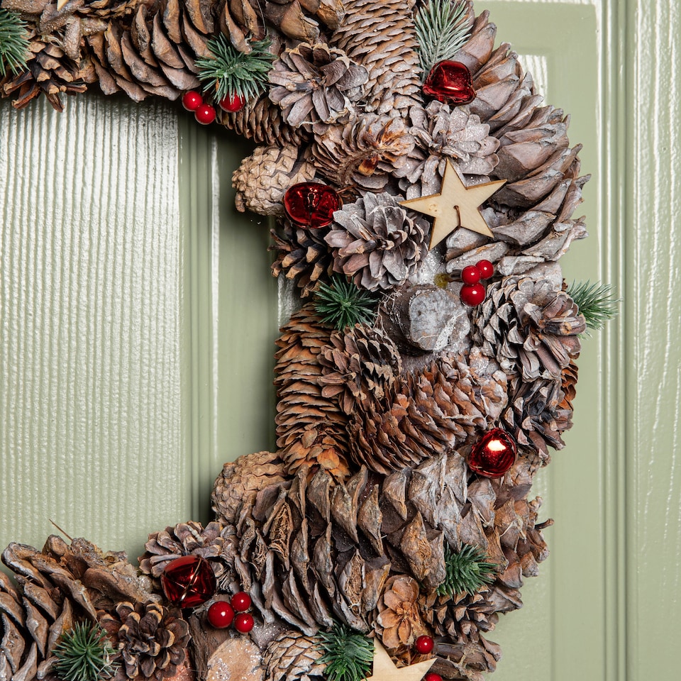 image 1 of 50cm Frosted Hanging Christmas Wreath with Red Jingle Bells & Wooden Stars