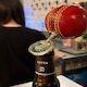 image 2 of CRICKET-GIFTS - Real Cricket Ball Bottle Opener | Made from Genuine Leather | For Cricket Fans | Unique Bar Accessory | Handmade and Designed in the UK
