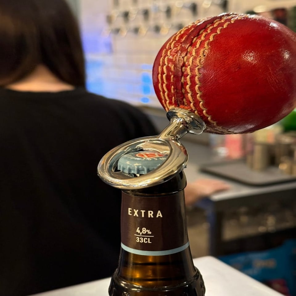 image 1 of CRICKET-GIFTS - Real Cricket Ball Bottle Opener | Made from Genuine Leather | For Cricket Fans | Unique Bar Accessory | Handmade and Designed in the UK