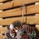 image 7 of 30cm Frosted Hanging Christmas Wreath with Pine Cones & Wooden Stars