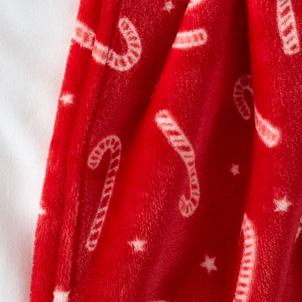 image 1 of Catherine Lansfield Christmas Candy Cane Cosy Fleece Blanket Throw