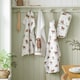 image 2 of Catherine Lansfield Angus Highland Cow Cotton Kitchen Tea Towel Pack of 4 Natural | Cream | Natural | One size | 4