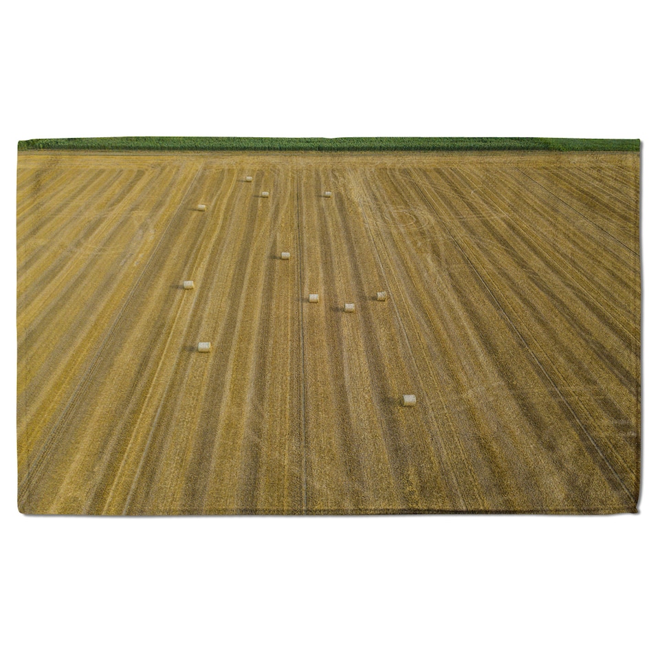 image 1 of straw bales of wheat lying on harvested field Designer Bath Towel | Multi