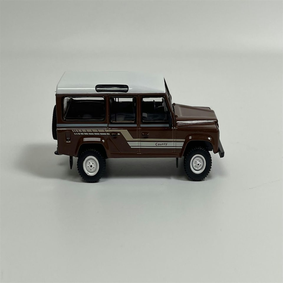 image 1 of Land Rover Defender 110 1985 County Station Wagon Russet Brown LHD 1:64 Mini GT MGT00734L