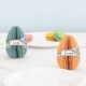 image 1 of Easter Egg Shaped 3D Honeycomb Customisable Place Card Decorations - Pack of 4