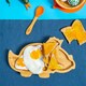 image 5 of Tiny Dining Children's Bamboo Silicone Tip Spoon - Orange