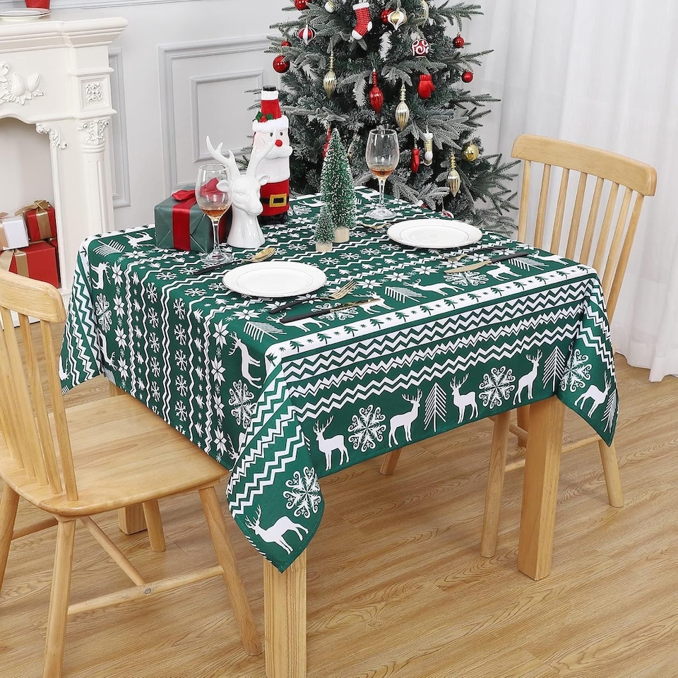 image 1 of London Boutique Christmas Tablecloth, Water‑Resistant, Boho Snowflake and Reindeer Print, Green, 52 x 52 in