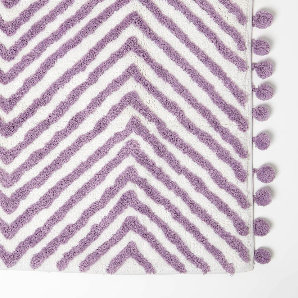 image 1 of Homescapes Lilac Cotton Bath Mat Tufted Zig Zag with Pom Pom Edges - 50 x 80 cm Purple