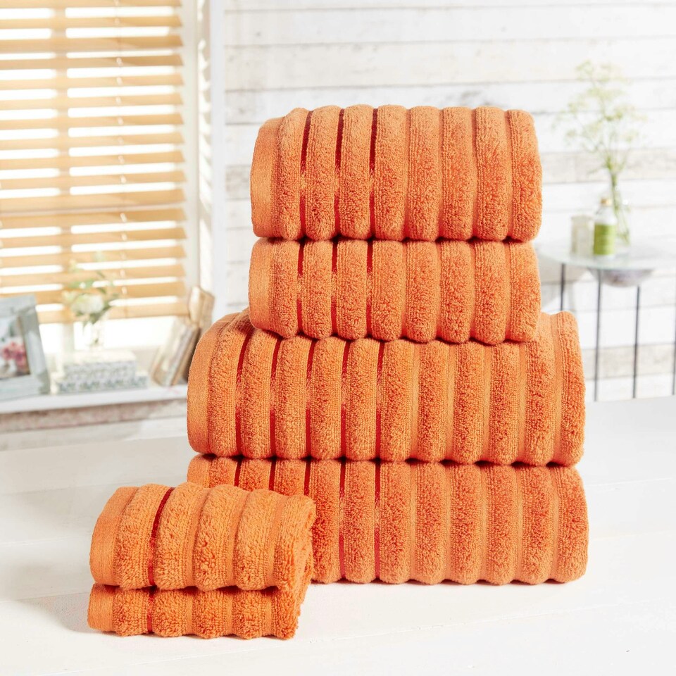 image 1 of Ribbed Pure Cotton Face Towels Super Soft and Absorbant Orange | Face cloth