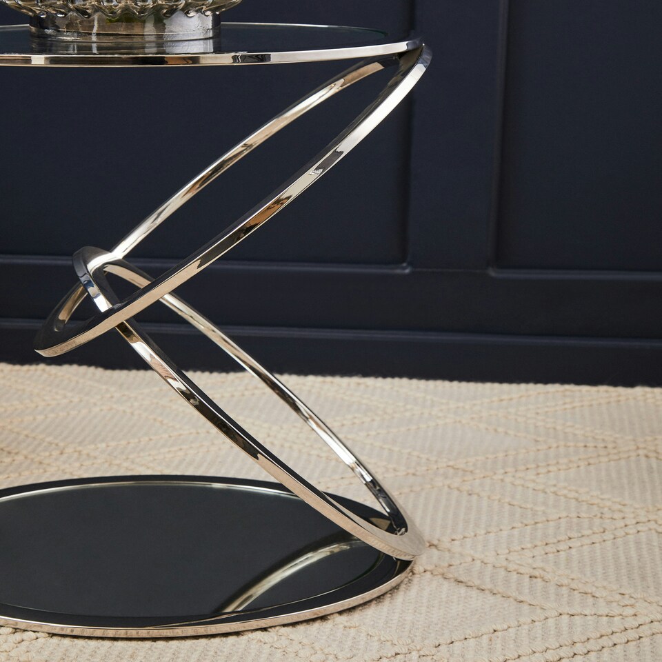 image 1 of Interiors by Premier Clear Glass End Table With Warm Metallic Frame, Luxe Interlocking Gold Ring Base, Modern Glass Top Silver