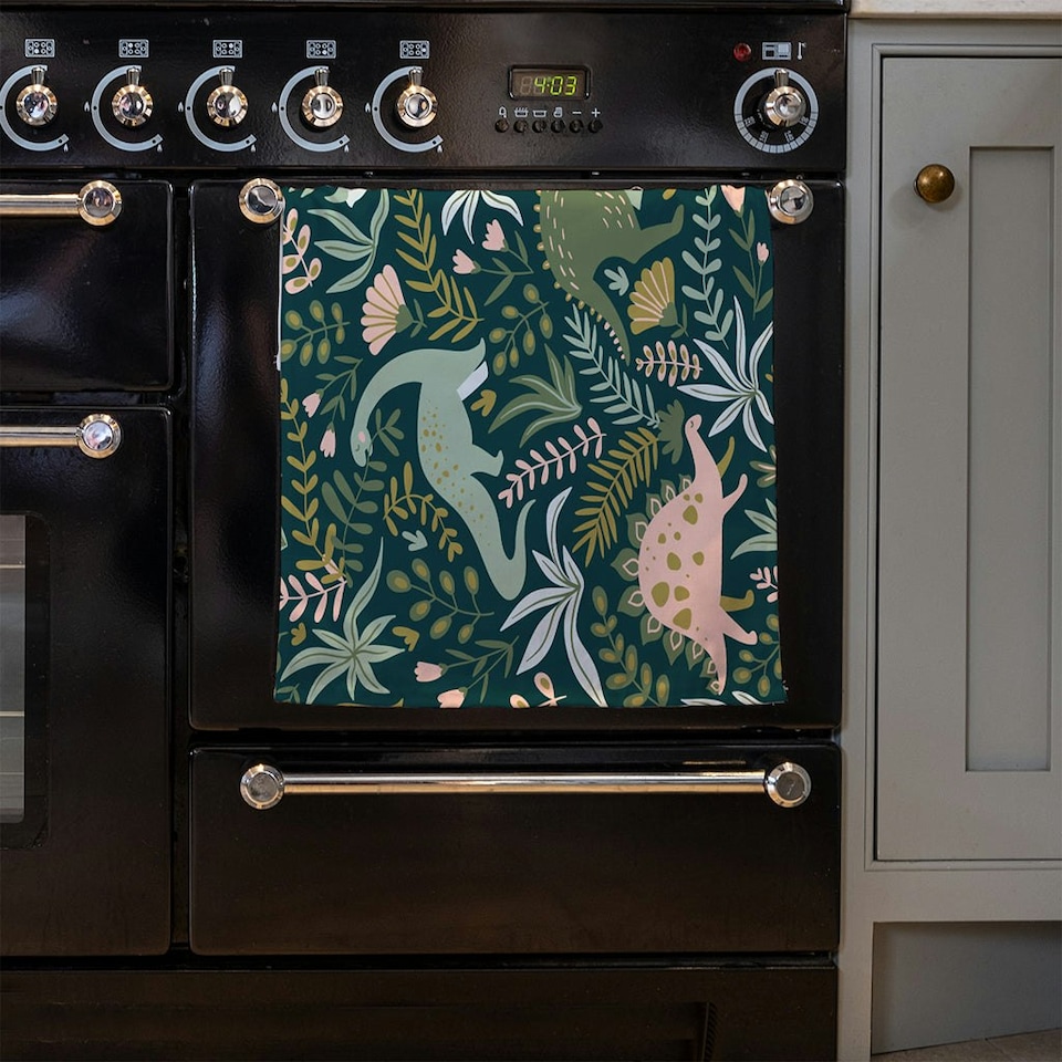 image 1 of Hand drawn dinosaurs and tropical leaves and flowers. (Kitchen Towel)