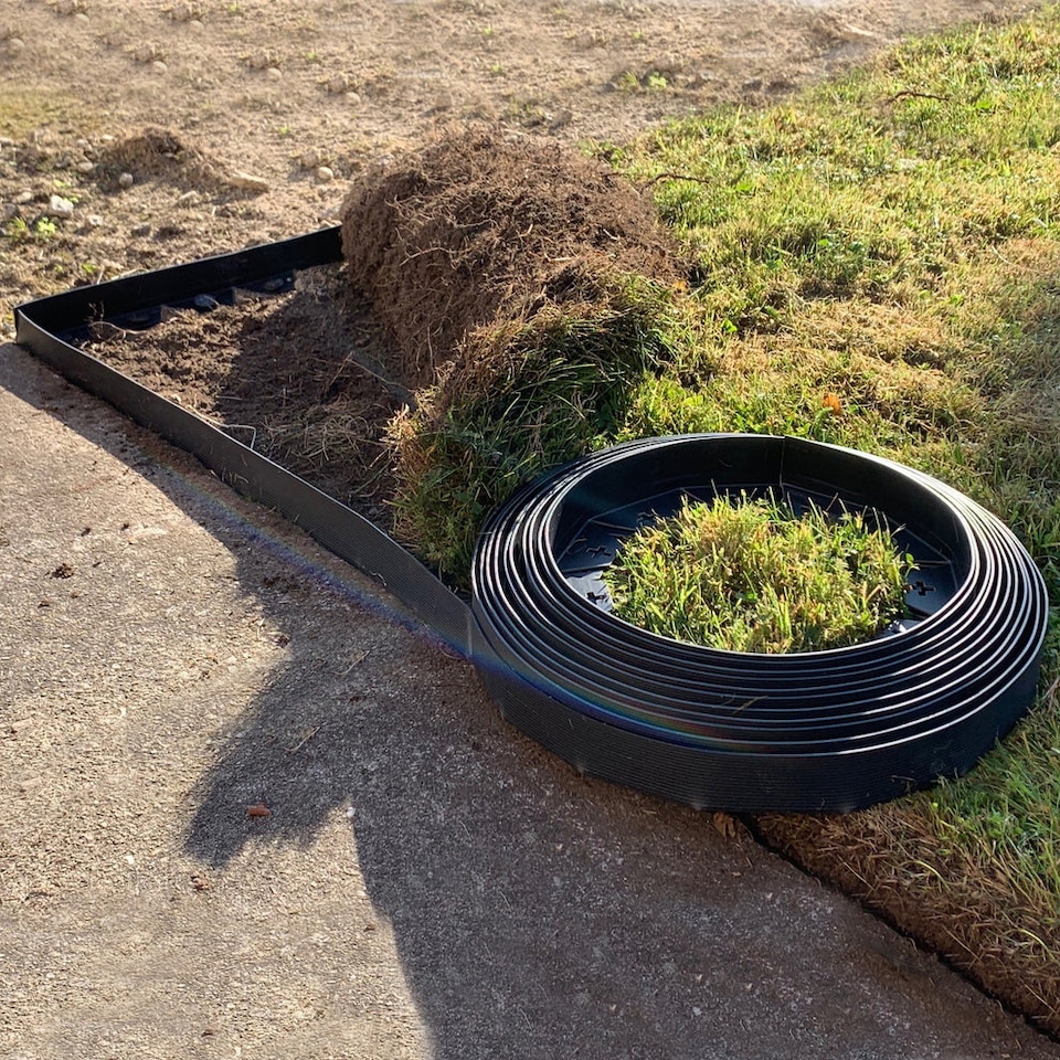 image 1 of Flexible Black Plastic Garden Lawn Edging with 40 Pegs (10m) - 3 Rolls