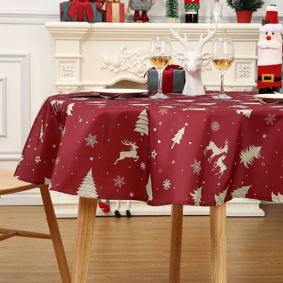 image 1 of London Boutique Round Christmas Tablecloth, Waterproof Washable, Deer Festive Print, Red‑Gold, 60 x 60 in