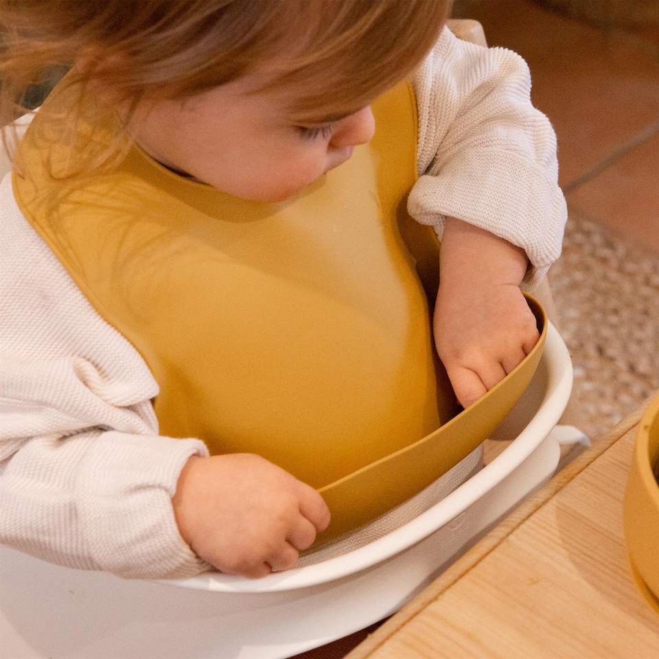 image 1 of Tiny Dining Baby Silicone Weaning Bib - Ochre | Yellow | Ochre
