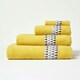 image 2 of Homescapes Geometric 100% Cotton Face Cloth - Ochre Yellow | Face cloth