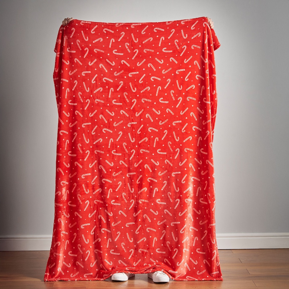 image 1 of Catherine Lansfield Christmas Candy Cane Cosy Fleece Blanket Throw