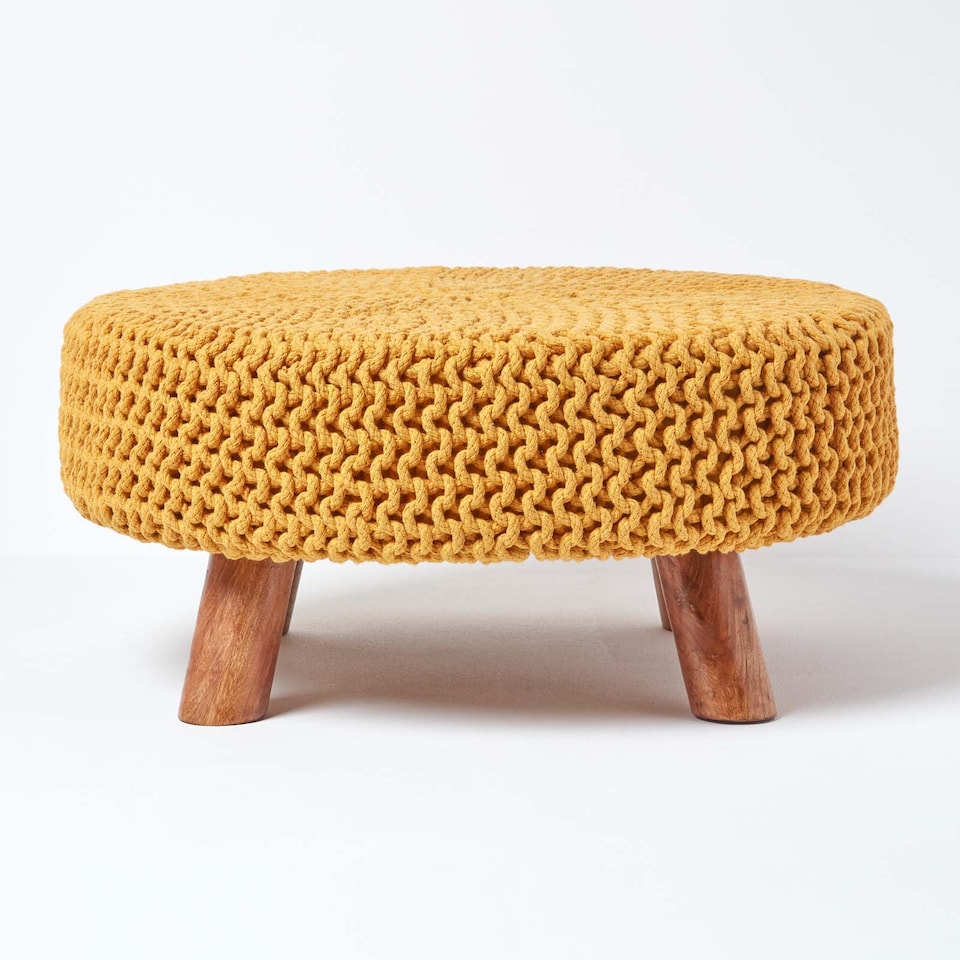 image 1 of Homescapes Mustard Large Round Cotton Knitted Footstool on Legs | Yellow | 62 x 62 x 30 cm