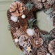 image 5 of 30cm Frosted Hanging Christmas Wreath with Pine Cones & Wooden Stars