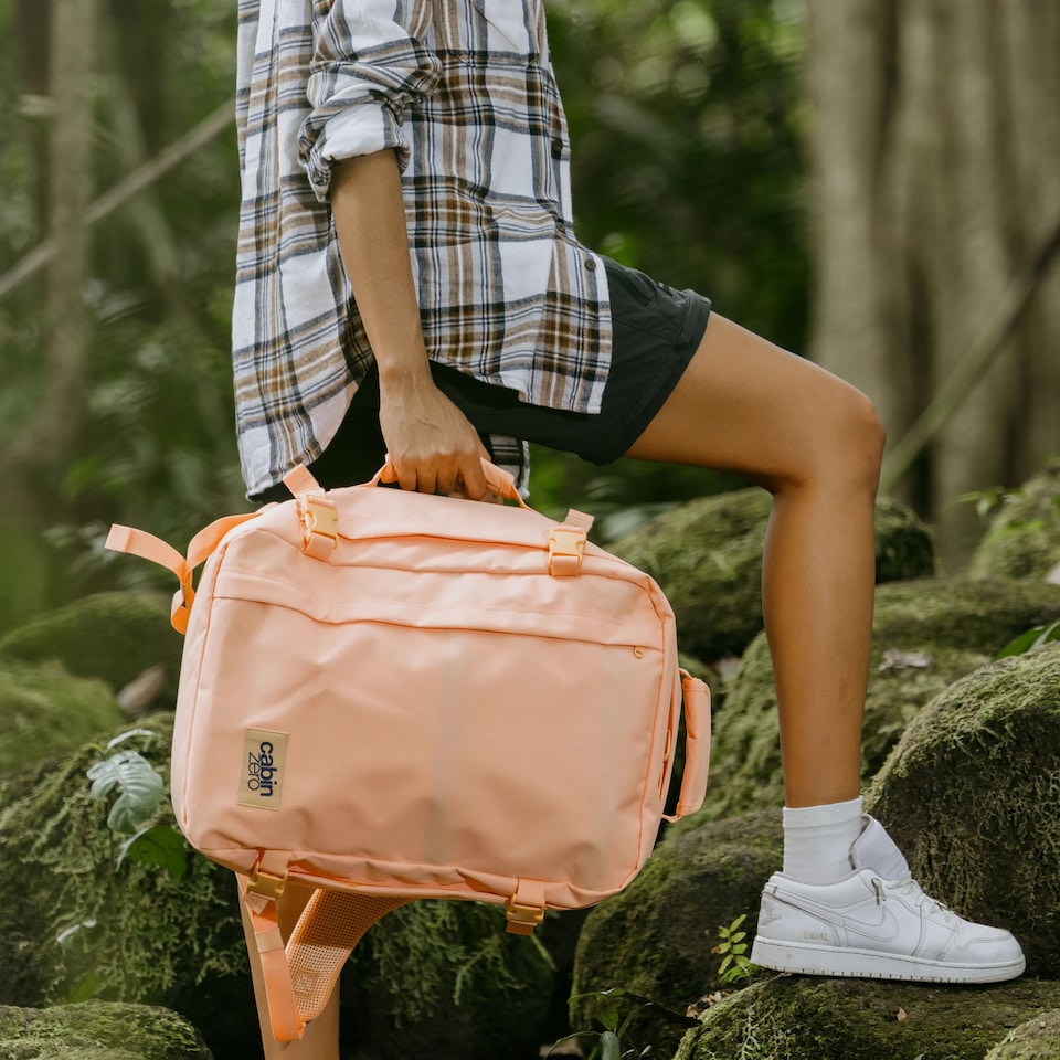 image 1 of CabinZero Classic Cabin Backpack 36L, Light & Roomy for Airline Overheads | Pink | Sunny Day