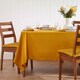 image 1 of Homescapes Mustard Yellow Tablecloth - 137 x 228 cm | Yellow | 137cm x 228cm (54" x 90")