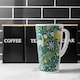 image 2 of Hand drawn dinosaurs and tropical leaves and flowers. Designer Latte Mug