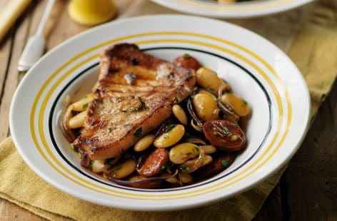 Image of "Griddled pork with butterbean and chorizo stew"