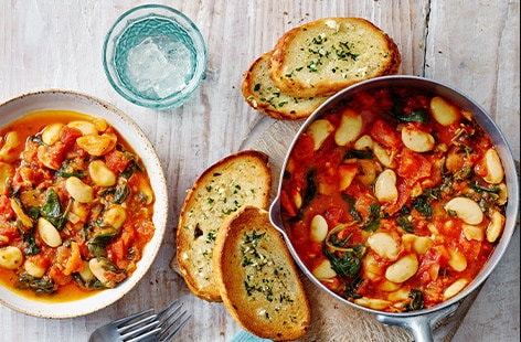 Image of "Butter bean and tomato stew with garlic bread"