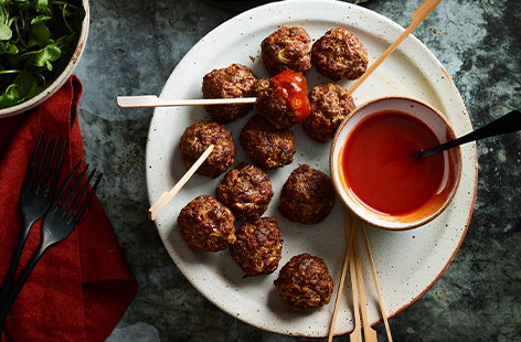 Beef meatball skewers with buffalo dipping sauce