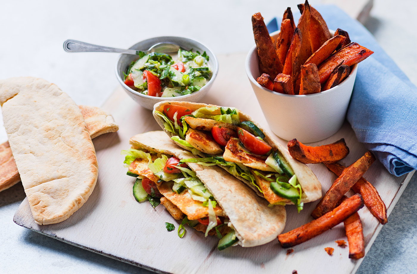 Halloumi pittas with sweet potato wedges