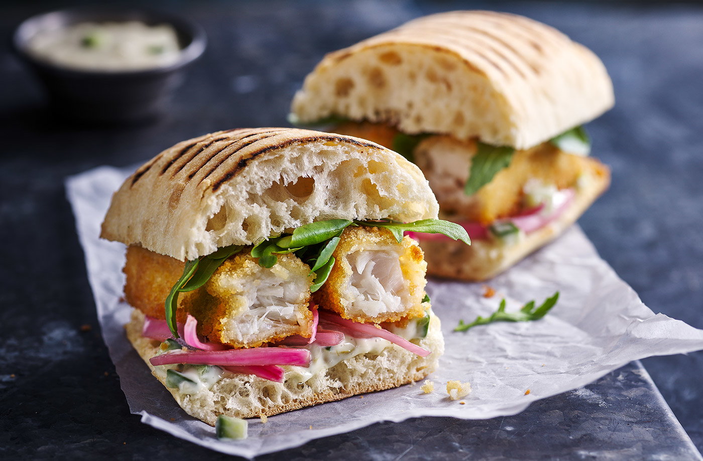 Fish finger and pickled pink onion panini