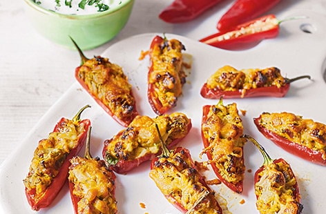 Image of "Chorizo-stuffed chillies with coriander dip"