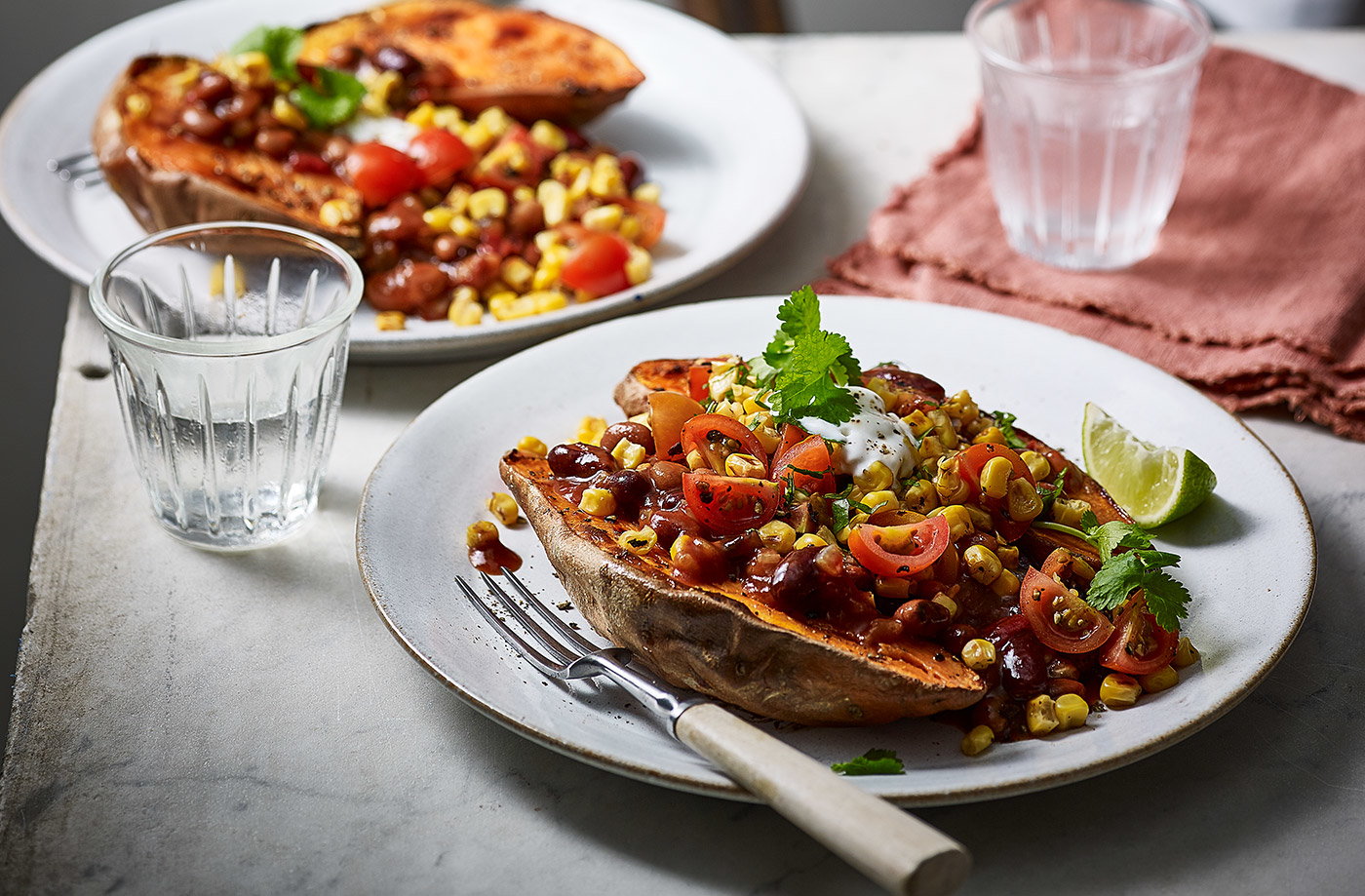 Baked sweet potatoes with fajita beans
