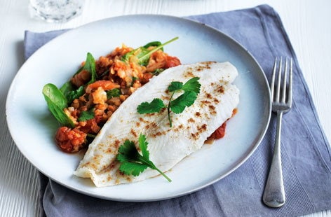 Image of "Pan-fried cobbler with red lentil and spinach dhal"