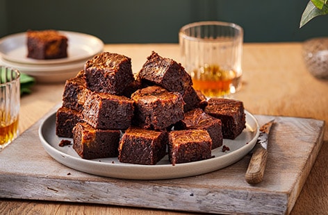 Image of "Chocolate brownie bites with a salted caramel whisky swirl"