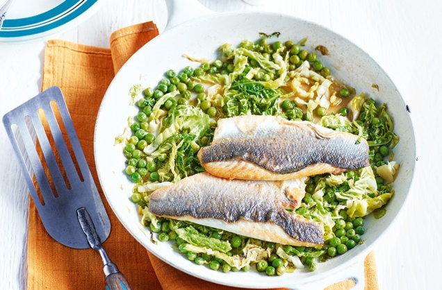 Buttery sea bass fillets with cider-braised greens