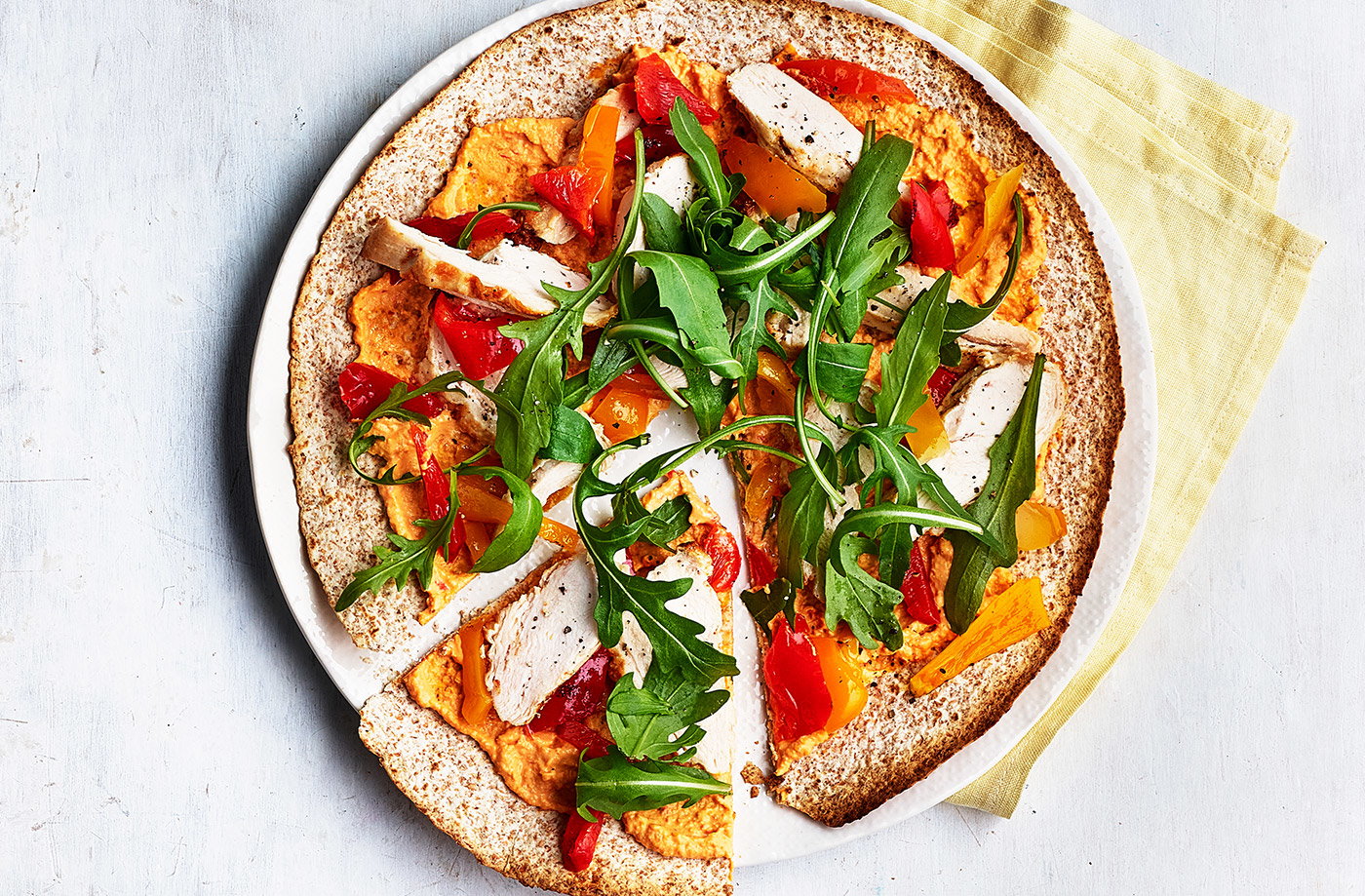 Spiced houmous and chicken 'pizzas'