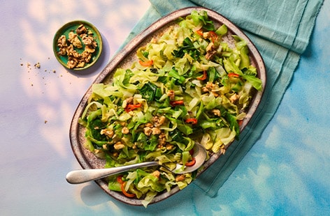 Shredded cabbage with shallots and walnuts