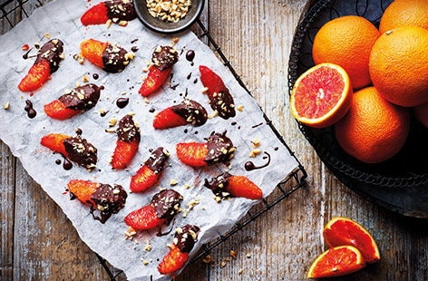 Image of "Chocolate-dipped orange segments"