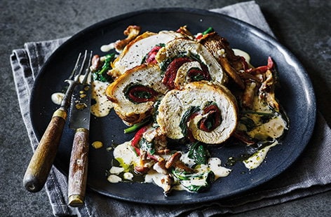Image of "Stuffed chicken with wild mushroom and brandy sauce"