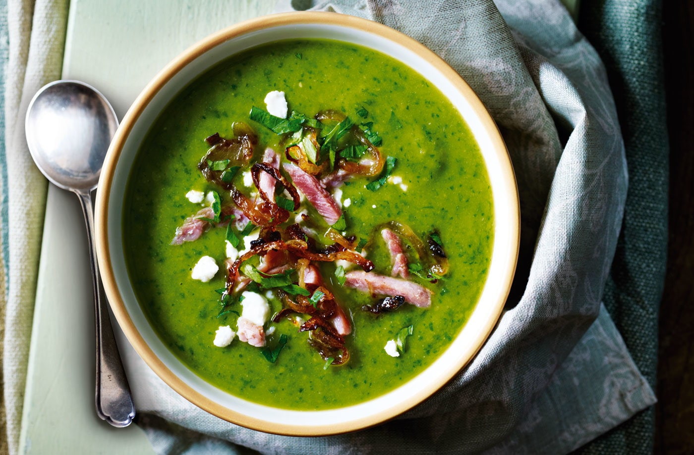 Ham and pea soup with crispy onions and feta