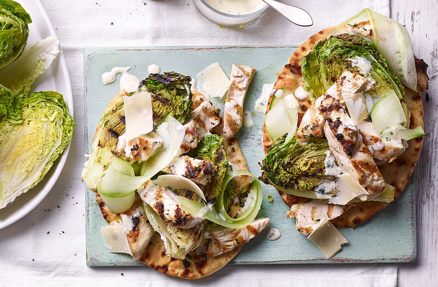 Grilled chicken Caesar salad with herby flatbreads