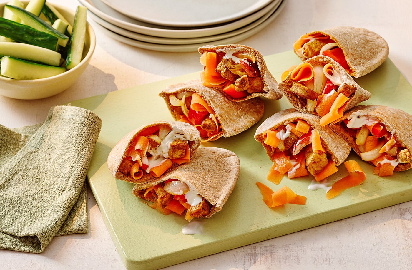 Spiced yogurt-marinated pork pittas