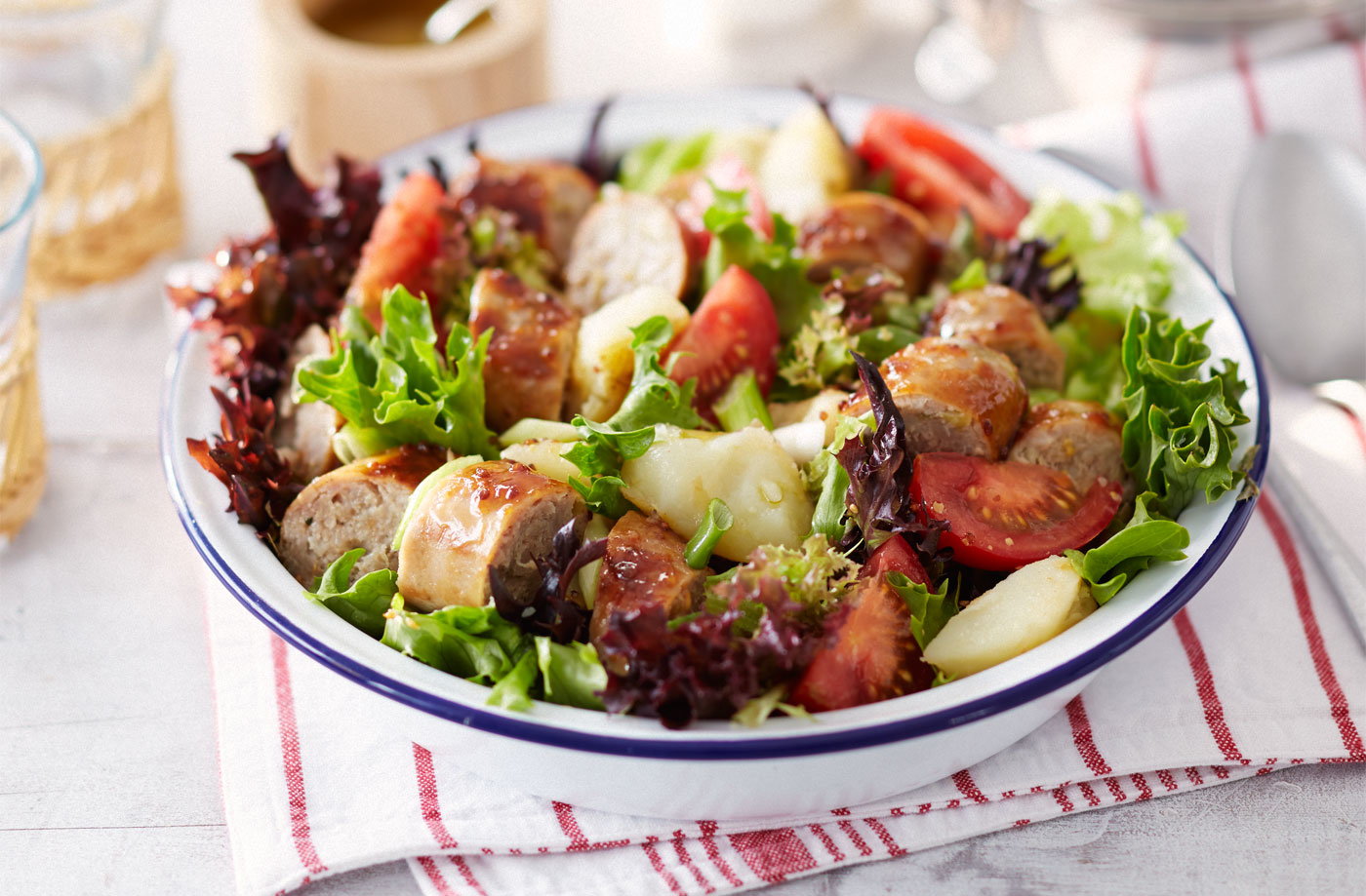 Sticky sausage and crushed new potato salad