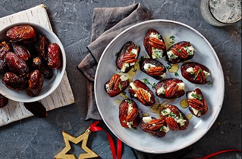 Image of "Blue cheese stuffed dates with maple pecans"