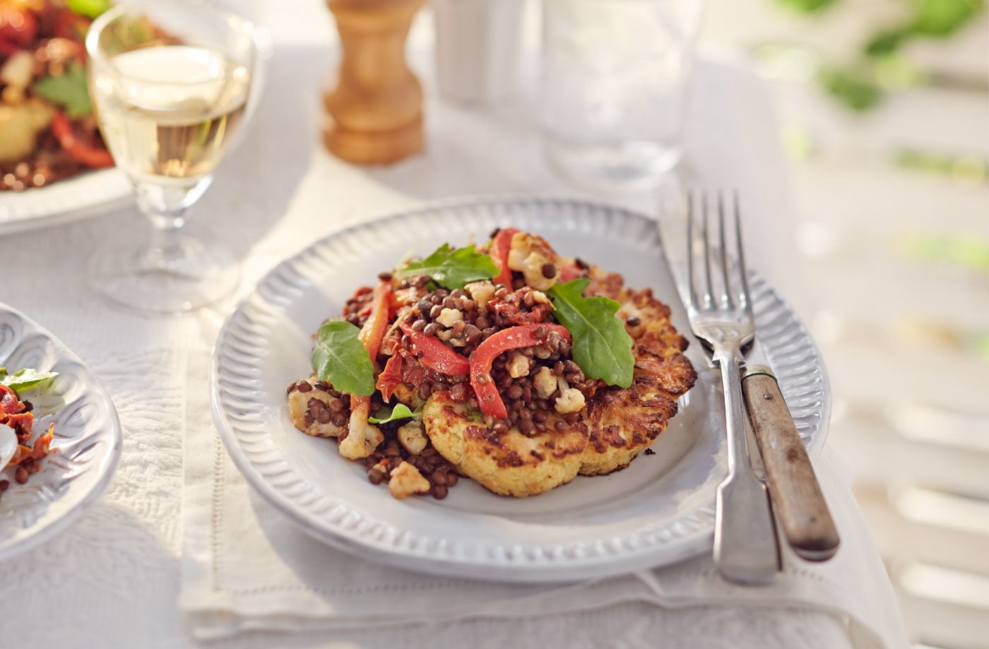 Roast cauliflower steaks with puy lentil, goat’s cheese and pepper salad