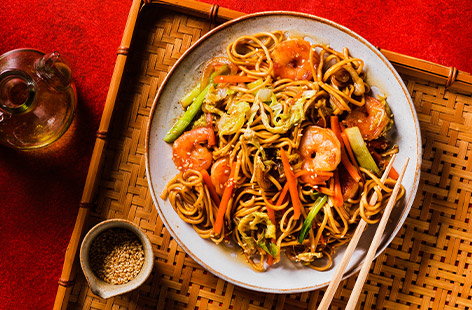 Image of "Golden 'long life' noodles with velvet king prawns"