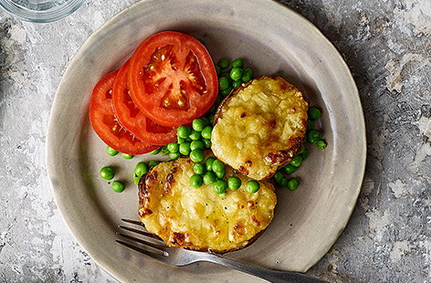 Cheesy stuffed potatoes with tomatoes and peas