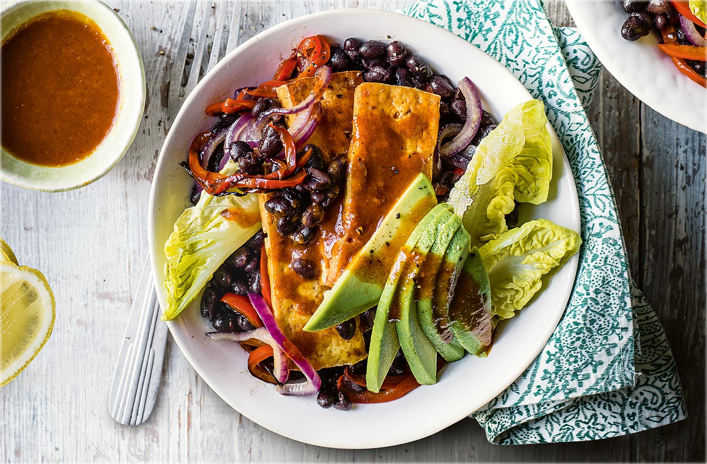 Buffalo tofu and black bean fajita bowls