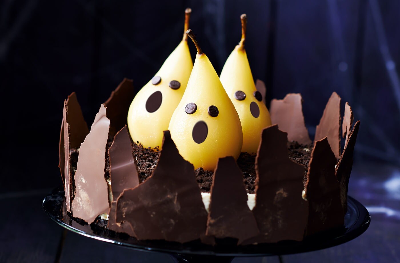 Rich chocolate cheesecake with ghostly pears